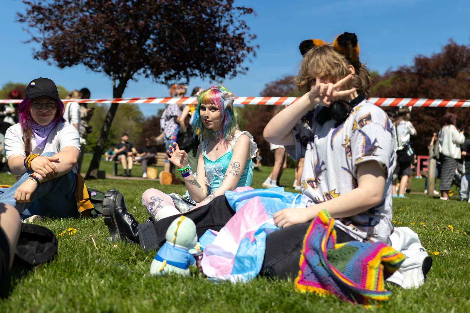Friends hanging out on the grass at Pups in the Park