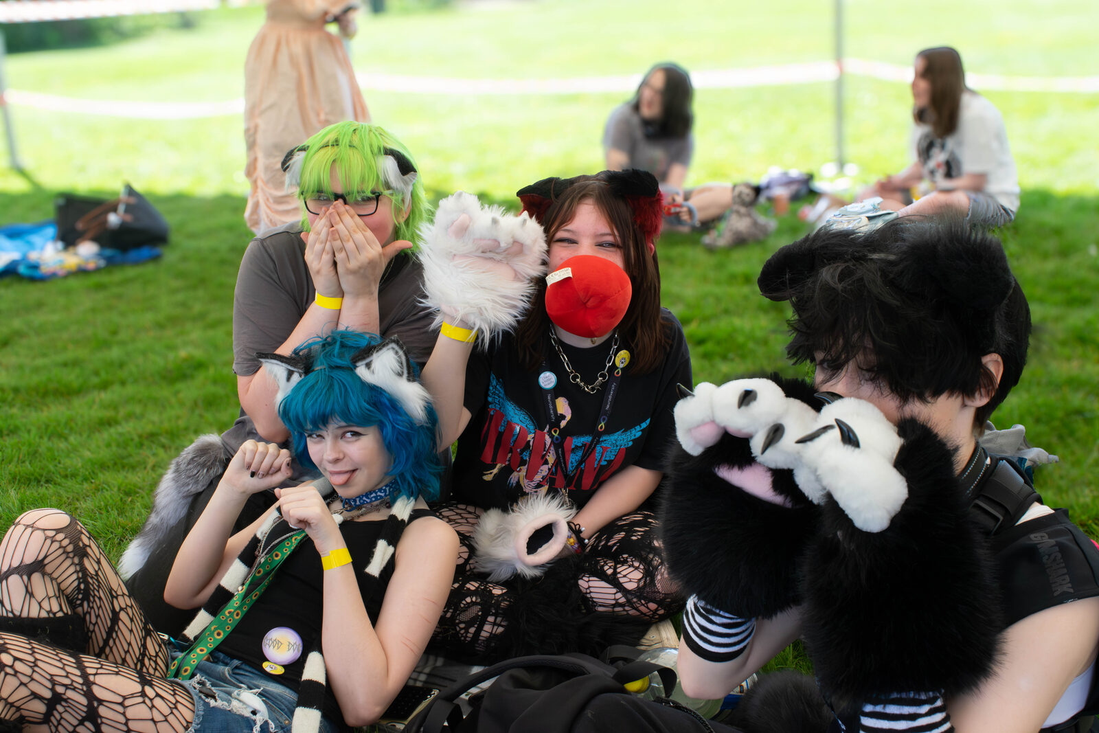 Friends sitting together at Pups in the Park